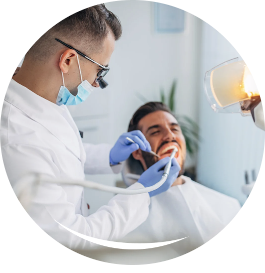 Dentist reviewing jaw model and digital X-ray on a tablet, showing advanced diagnostics for Implants.